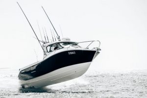 The “Veitch 27” - a fully trailerable, resin infused, composite game fishing boat diving into big Bass Strait swells.
