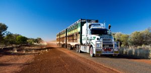 An iconic Mack Titian three-trailer Australian road train.